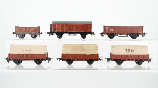 Trix H0 Konvolut 3 Niederbordwagen mit Planendach "Trix", 2 offene Güterwagen, gedeckter Güterwagen mit Bremserhaus DB/DR