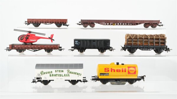 Piko/Roco/u.a. H0 Konvolut Niederbordwagen 4-achsig, Rungenwagen, gedeckter Güterwagen "Pivovar Brauerei", Niederbordwagen, Hochbordwagen, Kesselwagen "Shell" mit Schienenreiiger, Niederbordwagen mit Hubschrauber ÖBB/SNCF/CSD/DR/RN
