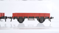 Fleischmann H0 Konvolut 4 Niederbordwagen, 2 Niederbordwagen mit Ladung, 2 achsig DB (1 Trittbrett abgebrochen)